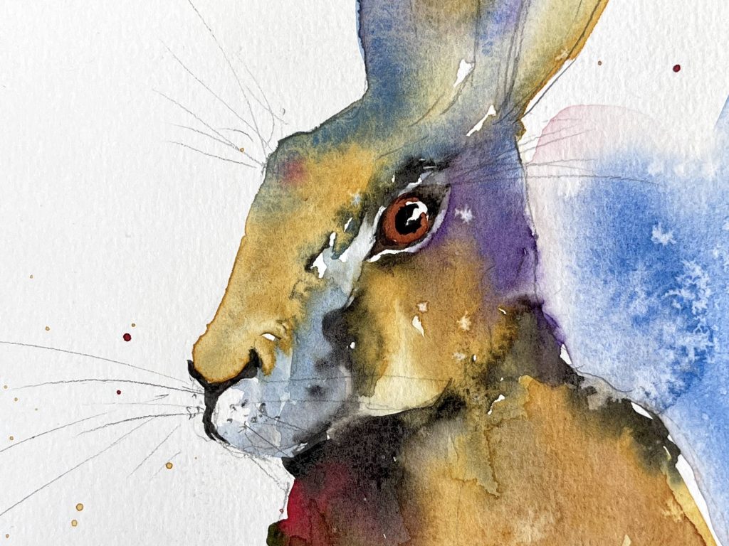 Closeup of watercolor Hare showing details of painting the face and using salt for texture in the background